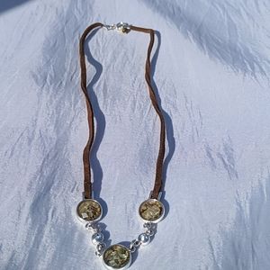 Brown cord with silver toned necklace